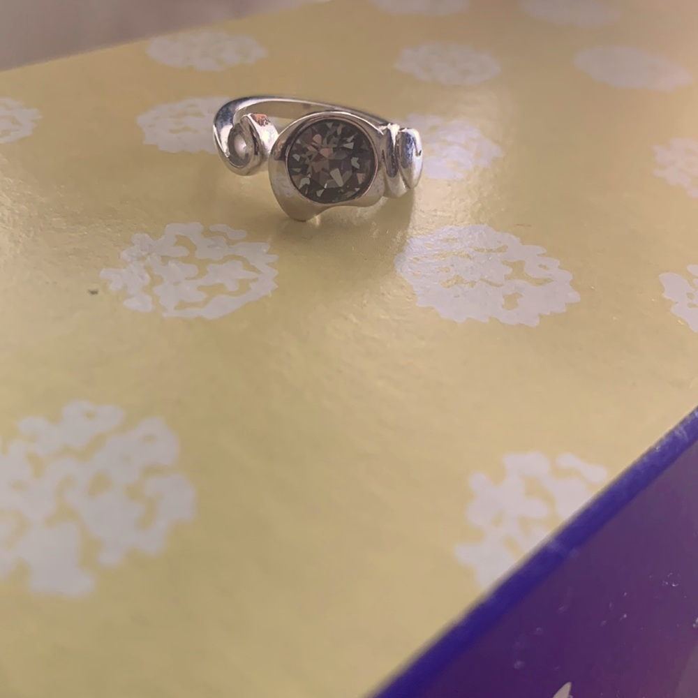 Beautiful silver rings with large gemstone in the center. Size 7, new.